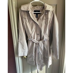 Trench coat color khaki in size small. Great condition. Comes with hoodie